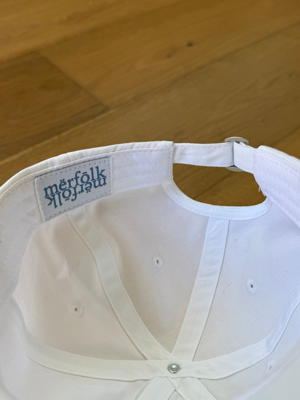 mërfōlk alt logo cap- white and blue